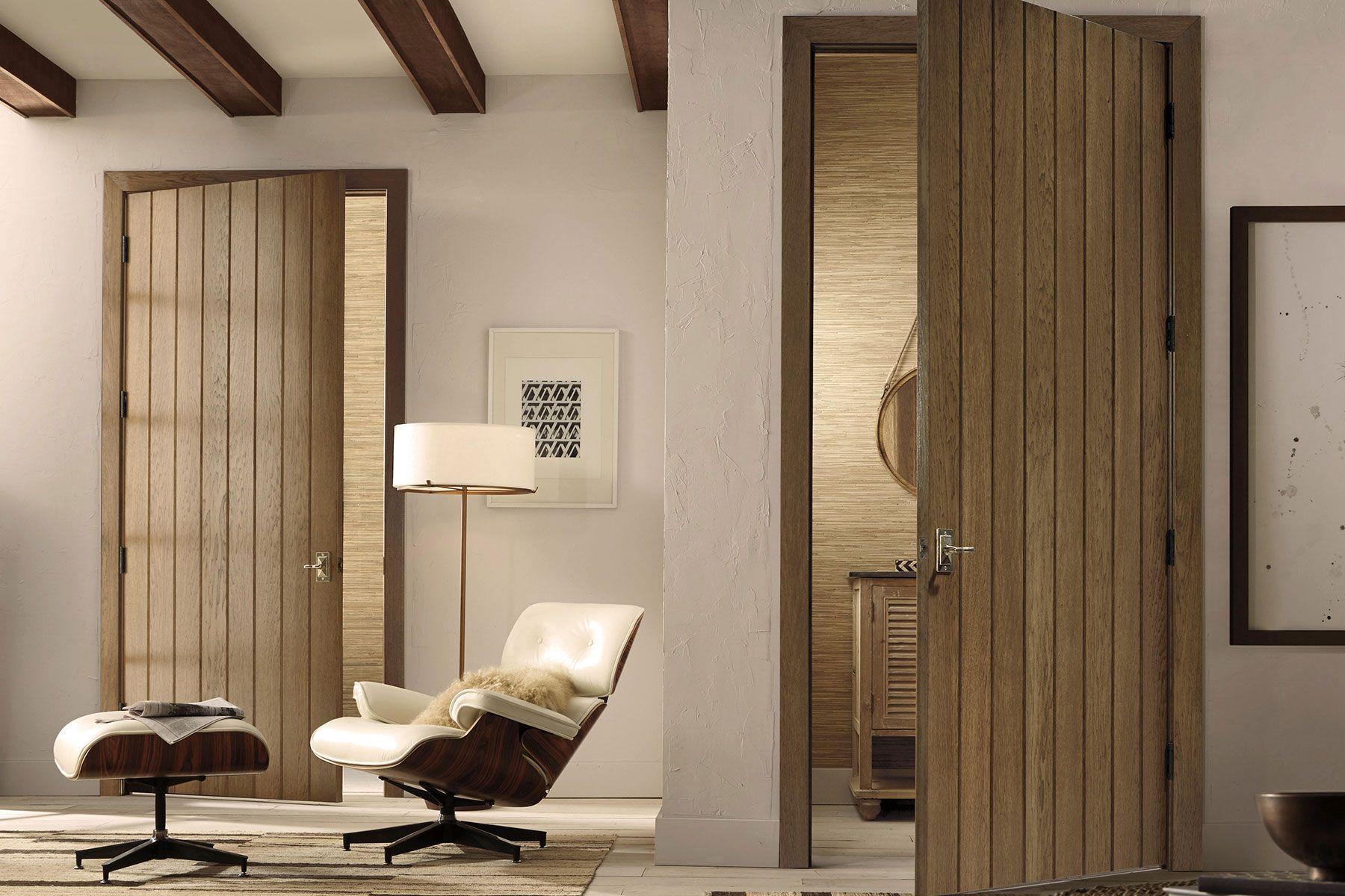 two wooden plank interior doors with vertical grooves